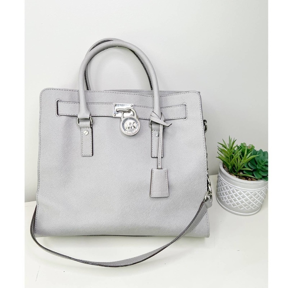 29-Michael Kors pearl gray handbag